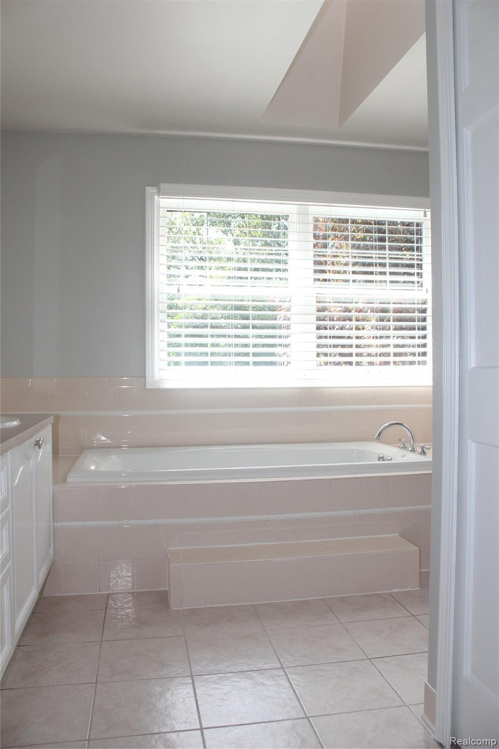 1794 Skyline Drive Rochester, MI 48306 - Photo 25 of 41 Skyline 24- Tile Master Bath with Jetted Tub, Shower, and Skylight.JPG