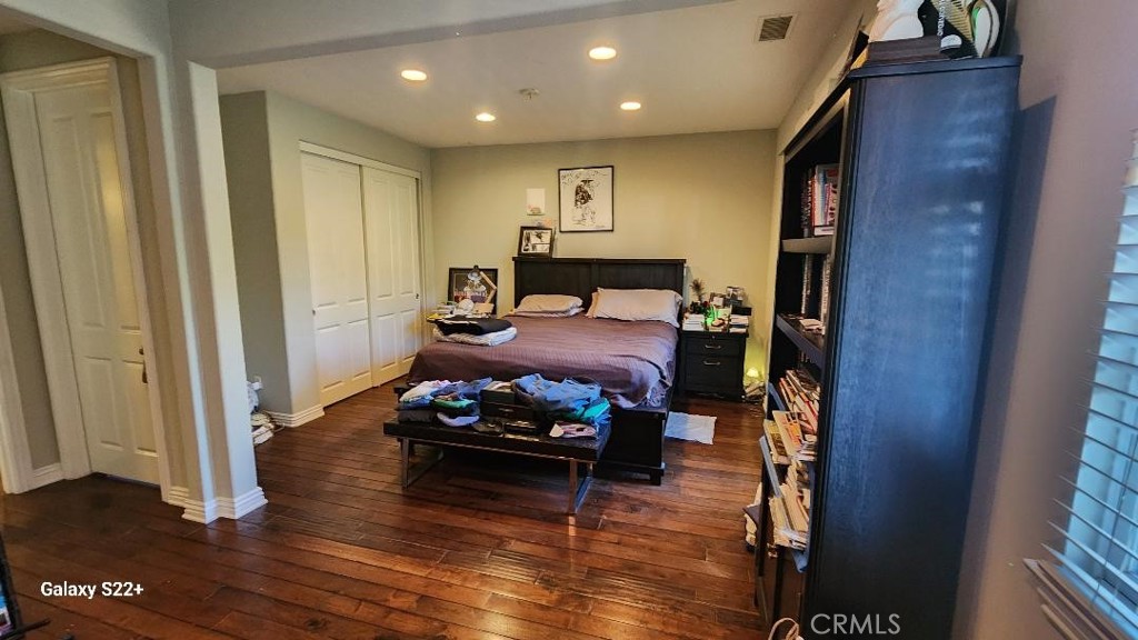 4591 Camino Del Sol Calabasas, CA 91302 - Photo 11 of 21 a bedroom with furniture and a wooden floor