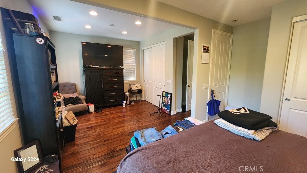 4591 Camino Del Sol Calabasas, CA 91302 - Photo 12 of 21 a bedroom with furniture and a window