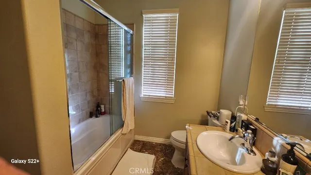 a bathroom with a sink a bathtub and a shower