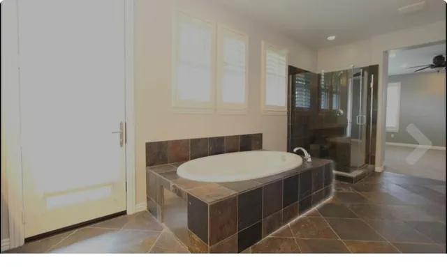 a bathroom with a sink double vanity granite and a mirror