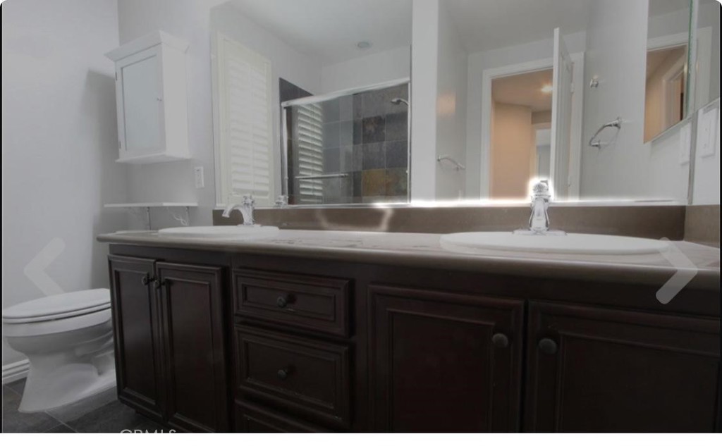 4591 Camino Del Sol Calabasas, CA 91302 - Photo 20 of 21 a bathroom with a sink and a mirror