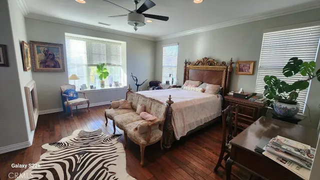 a bedroom with furniture and a window