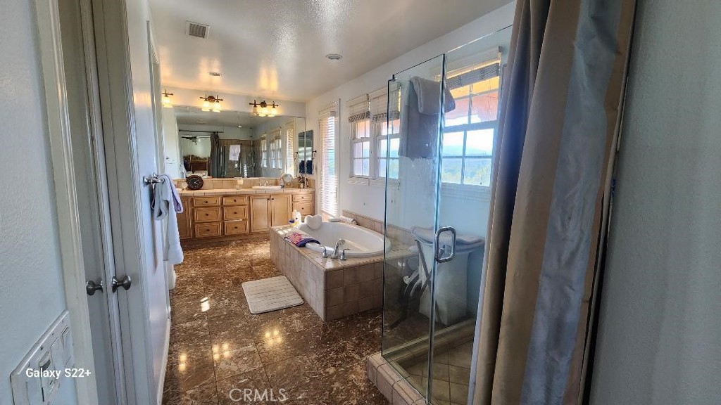 4591 Camino Del Sol Calabasas, CA 91302 - Photo 4 of 21 a living room with furniture and a chandelier
