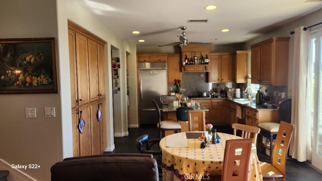 4591 Camino Del Sol Calabasas, CA 91302 - Photo 9 of 21 a very nice looking dining room with a large window and kitchen view