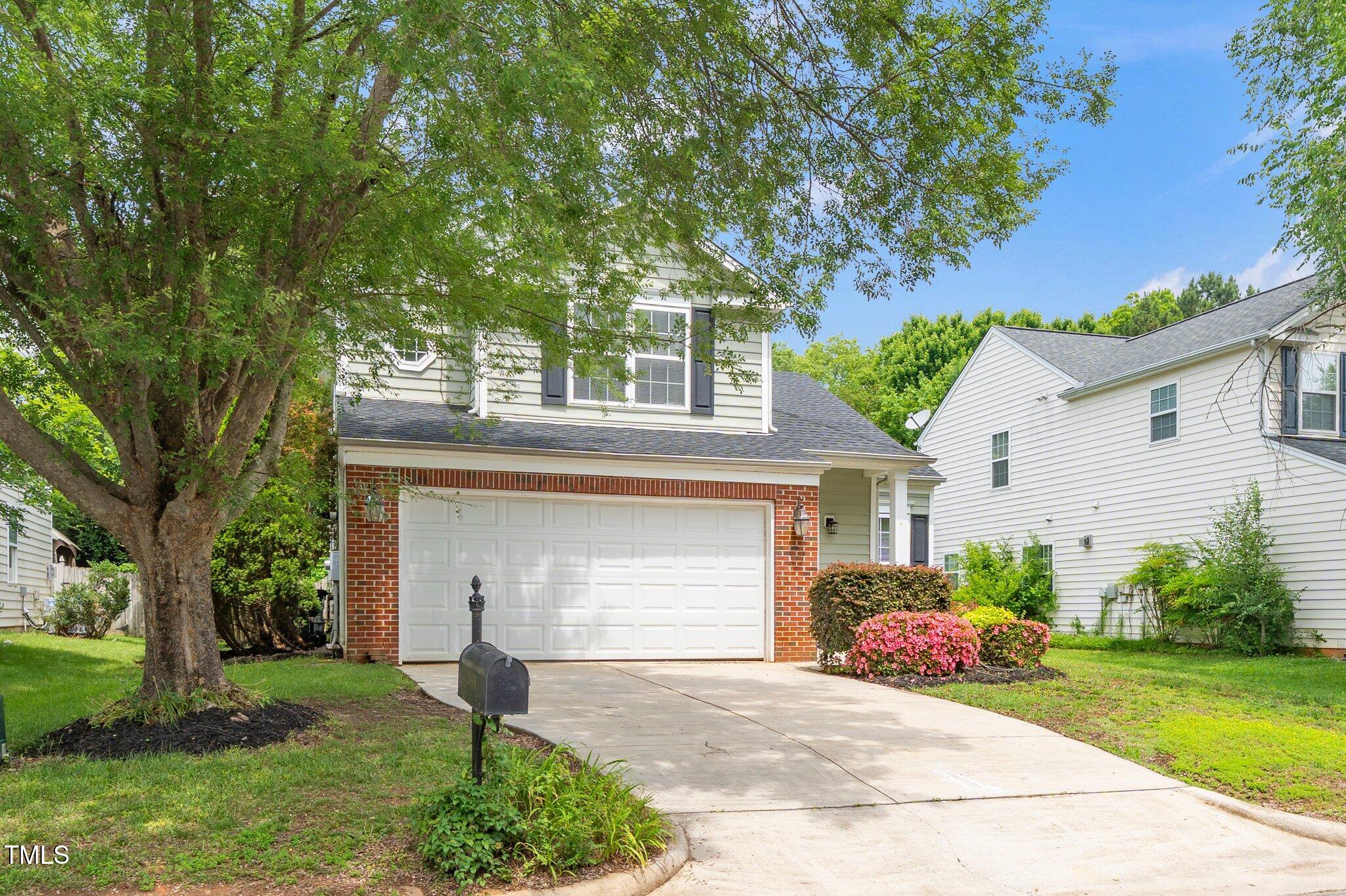 248 Inkster Cove Raleigh, NC 27603 - Photo 1 of 32 a front view of a house with garden