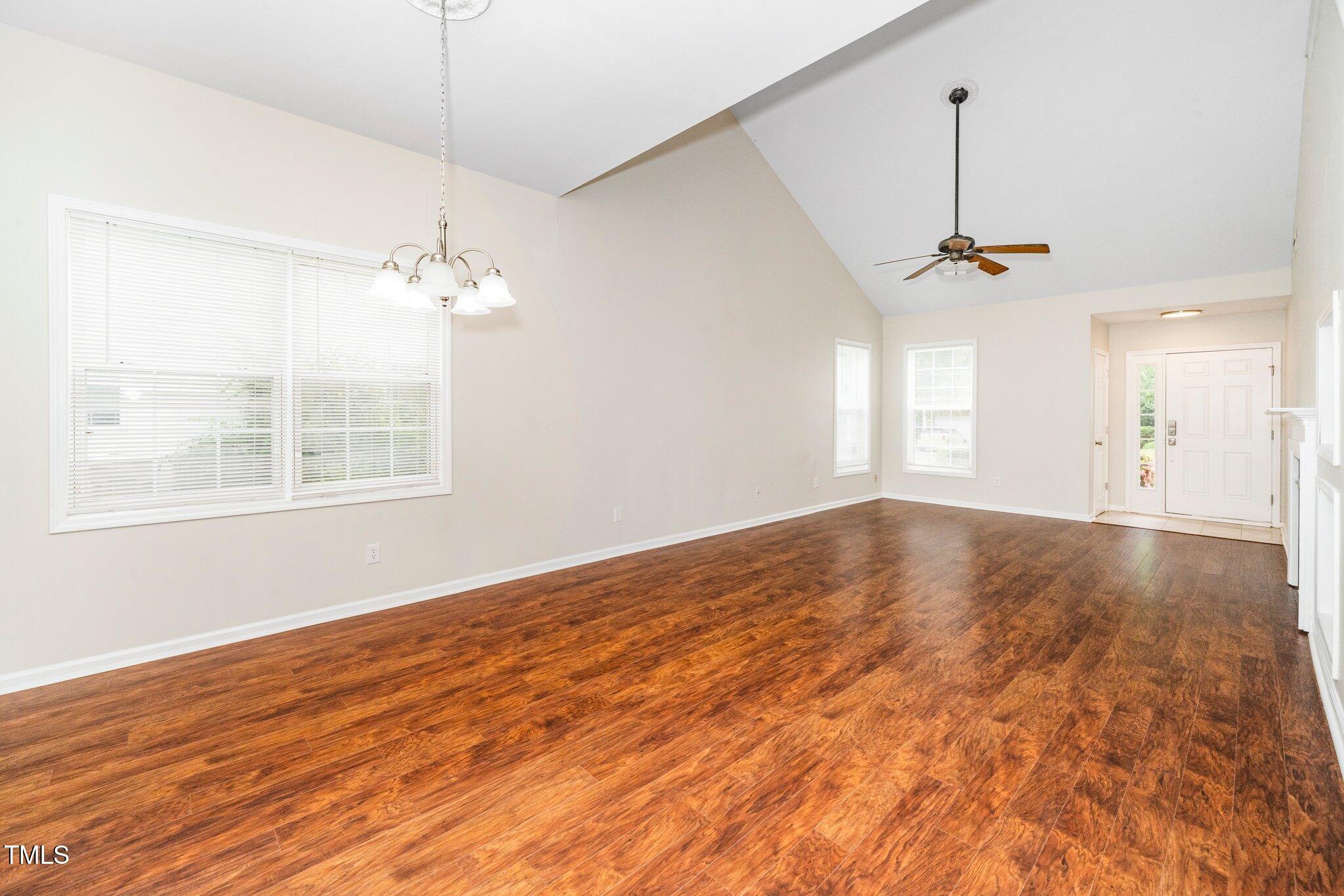 248 Inkster Cove Raleigh, NC 27603 - Photo 11 of 32 a view of empty room with wooden floor and fan
