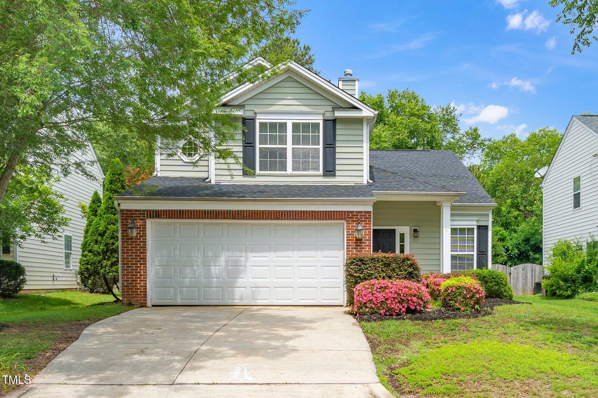 248 Inkster Cove Raleigh, NC 27603 - Photo 2 of 32 a front view of a house with garden