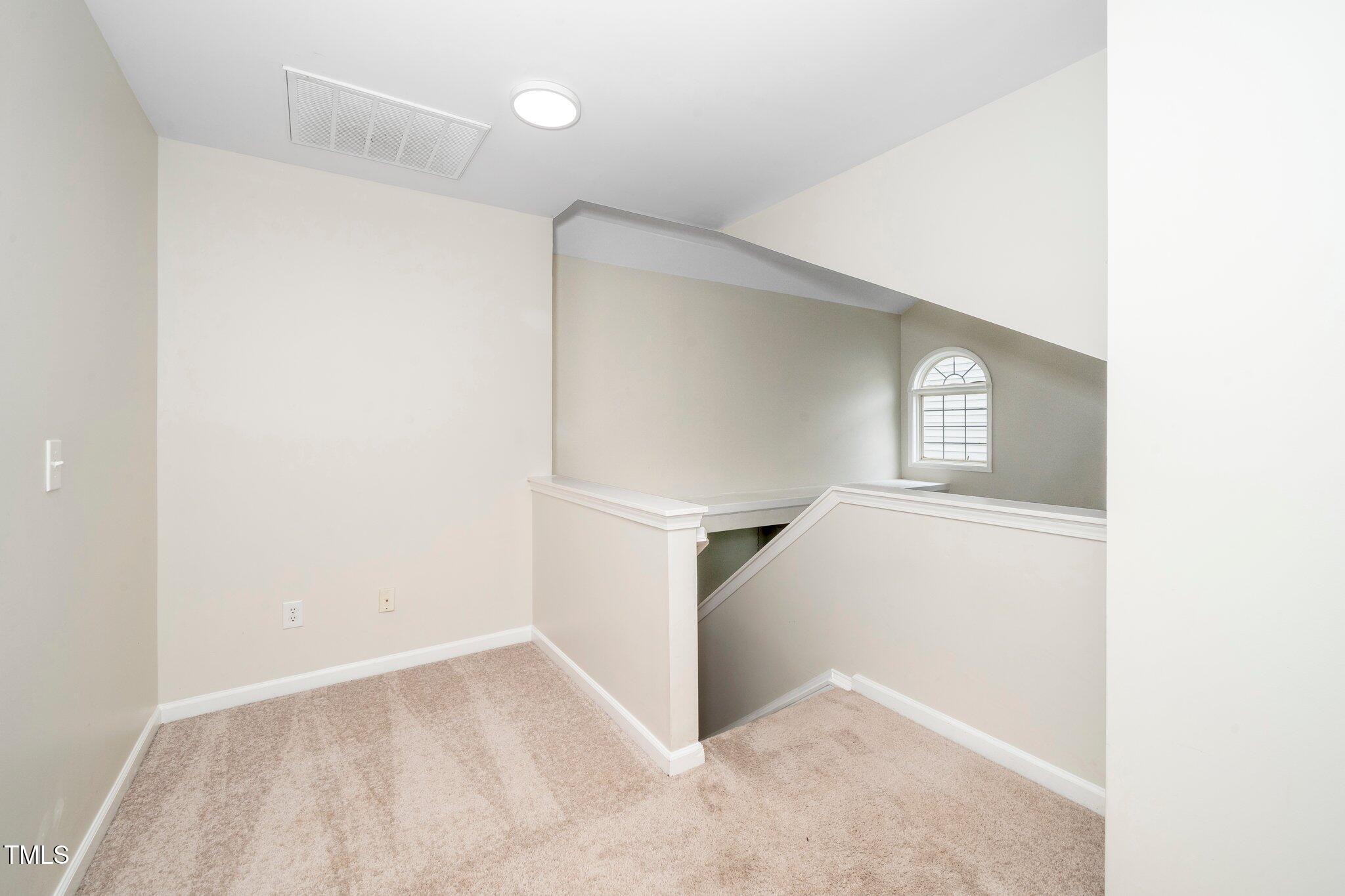 248 Inkster Cove Raleigh, NC 27603 - Photo 25 of 32 a view of an empty room with windows
