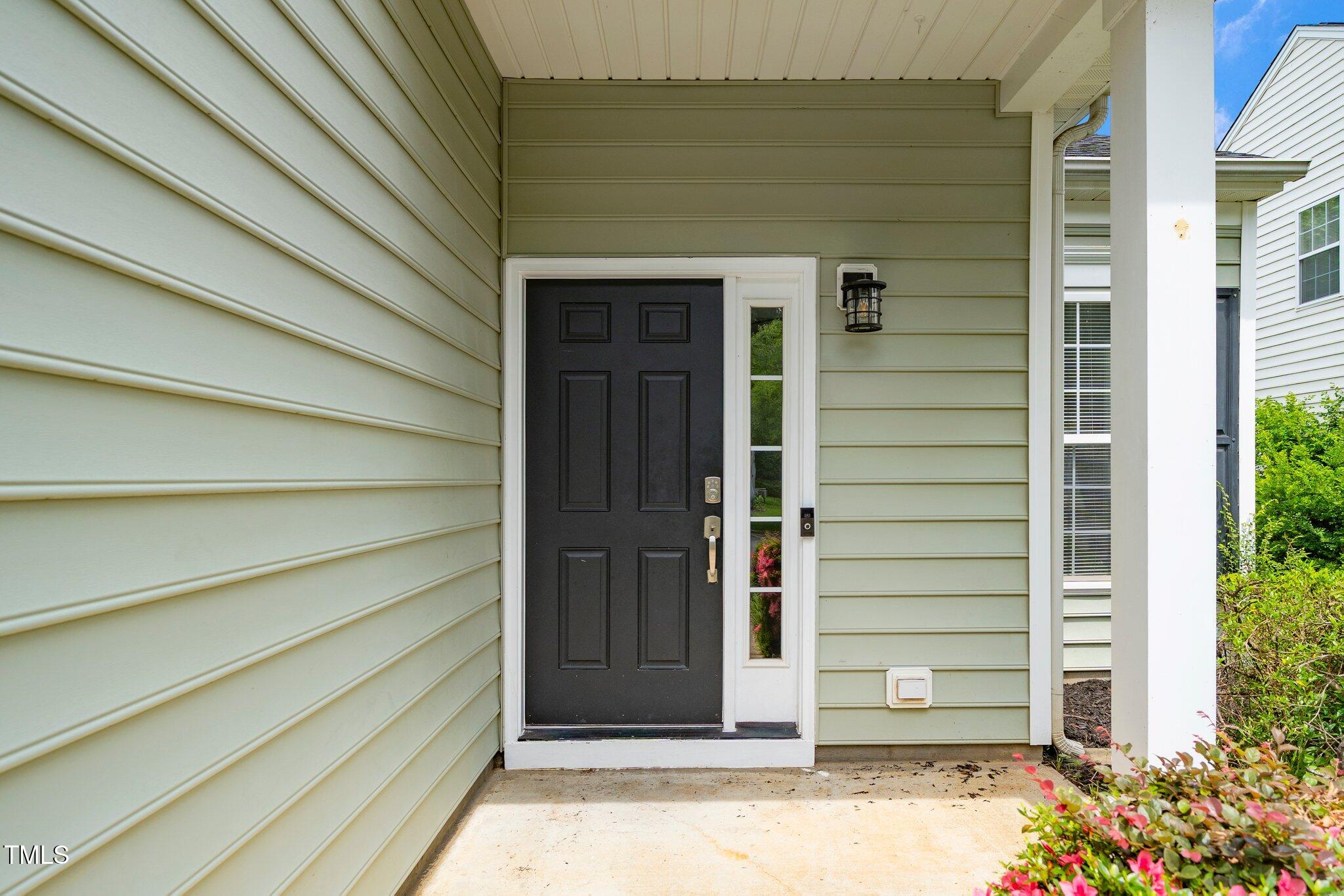 248 Inkster Cove Raleigh, NC 27603 - Photo 4 of 32 a view of entrance door of the house