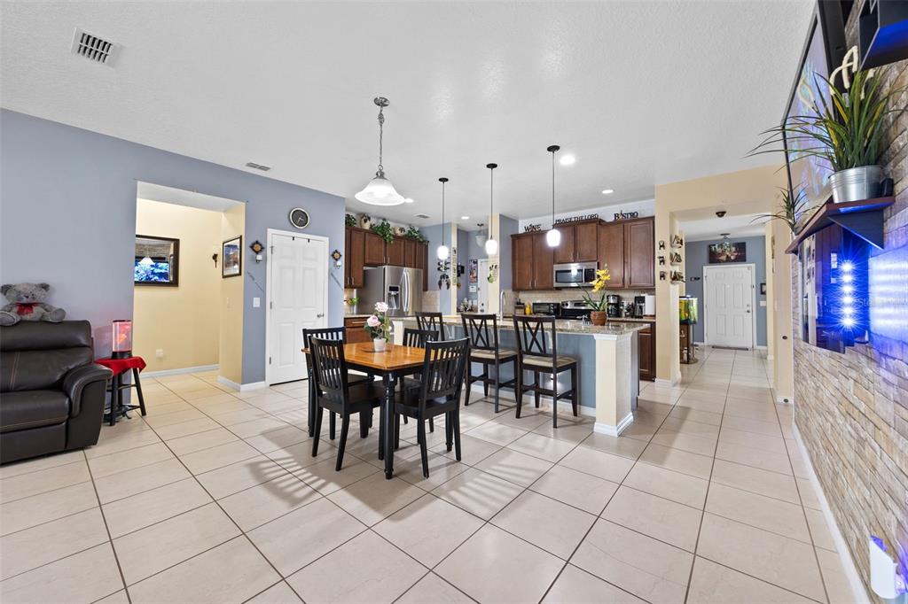 3409 Brant Street St. Cloud, FL 34772 - Photo 13 of 36 a view of a dining area with furniture