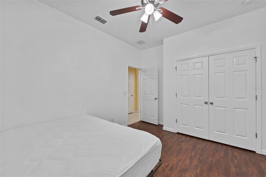 3409 Brant Street St. Cloud, FL 34772 - Photo 24 of 36 wooden floor in an empty room with a window