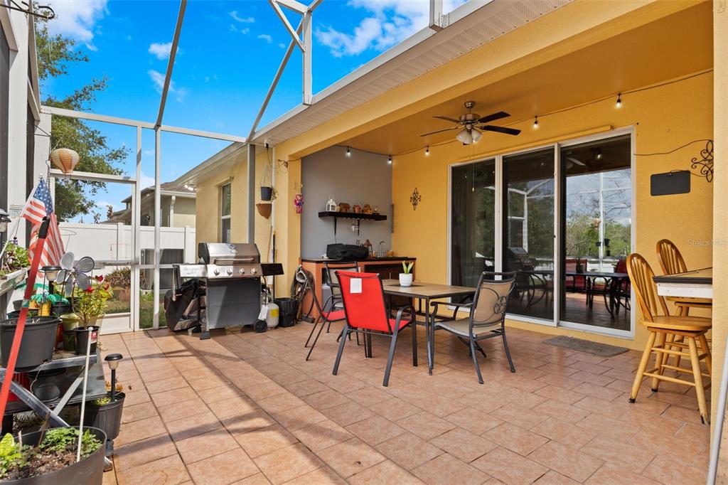 3409 Brant Street St. Cloud, FL 34772 - Photo 28 of 36 a patio with a table and chairs