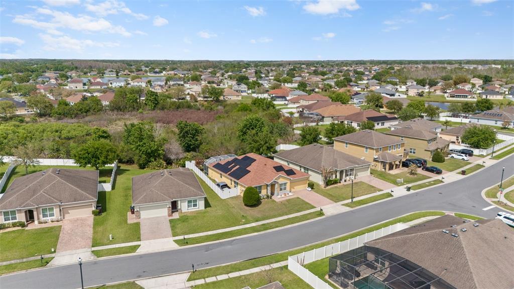 3409 Brant Street St. Cloud, FL 34772 - Photo 32 of 36 an aerial view of residential houses with outdoor space