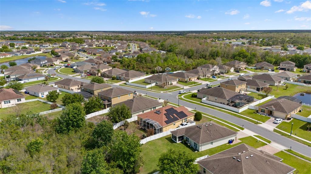 3409 Brant Street St. Cloud, FL 34772 - Photo 33 of 36 an aerial view of a house with a lake view