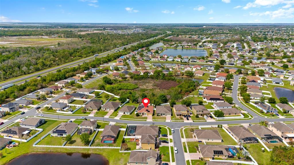 3409 Brant Street St. Cloud, FL 34772 - Photo 36 of 36 an aerial view of residential building and lake