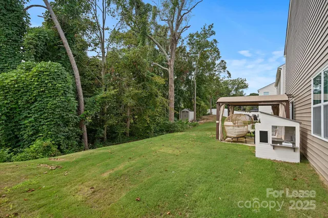 a view of a house with a yard porch and sitting area