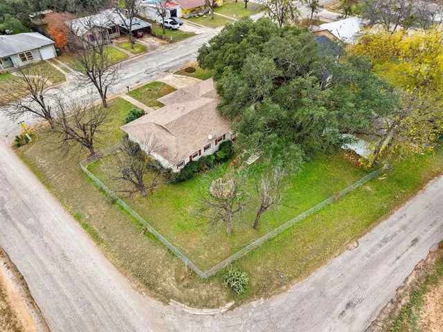 a view of a swimming pool with a yard