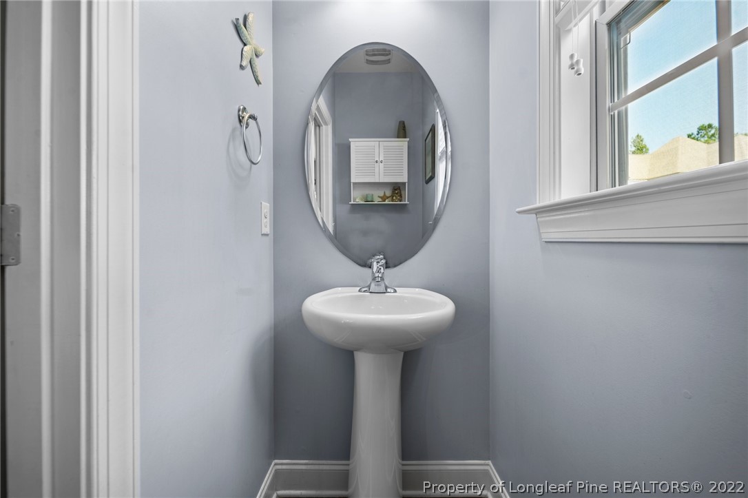 228 Culpepper Road Cameron, NC 28326 - Photo 18 of 36 a front view of a house with mirror gate