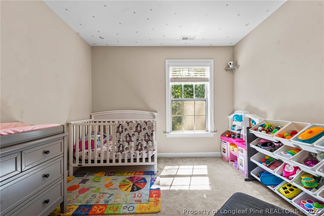 228 Culpepper Road Cameron, NC 28326 - Photo 23 of 36 a bedroom with furniture with toys and a baby crib