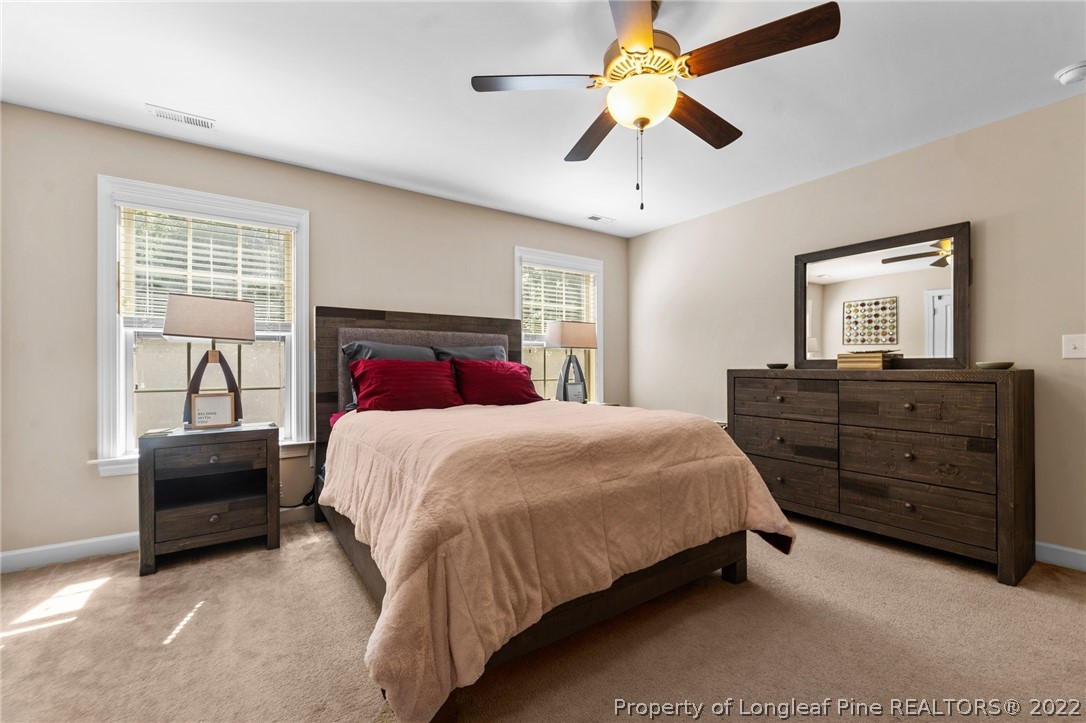228 Culpepper Road Cameron, NC 28326 - Photo 25 of 36 a bedroom with a bed and a dresser