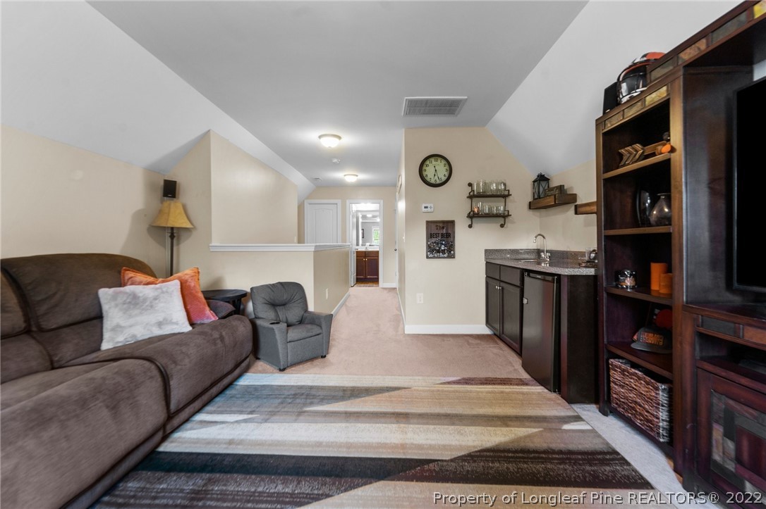 228 Culpepper Road Cameron, NC 28326 - Photo 29 of 36 a living room with stainless steel appliances furniture and a kitchen view