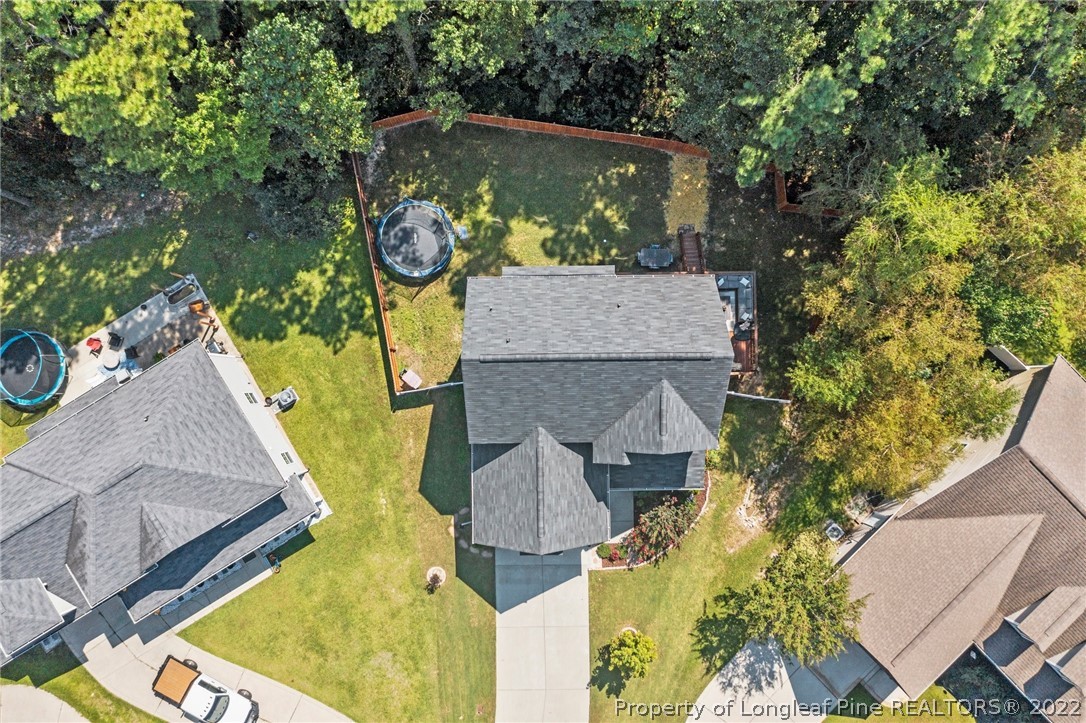 228 Culpepper Road Cameron, NC 28326 - Photo 4 of 36 an aerial view of a house with swimming pool and large trees