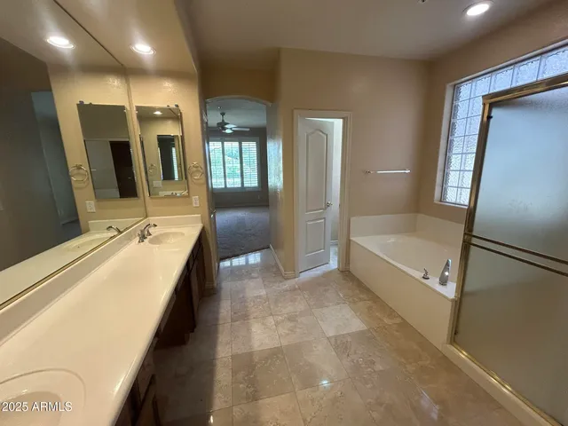 a view of an empty room with refrigerator and an empty room