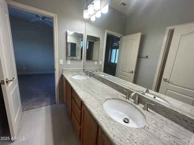 a white toilet sitting next to a bath tub