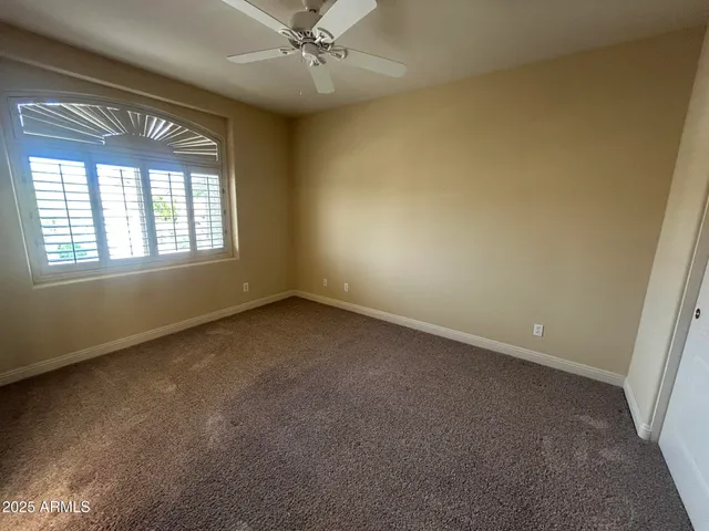 a view of an empty room with a bathroom