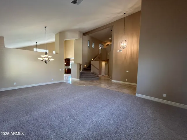 a view of livingroom with window fireplace and windows