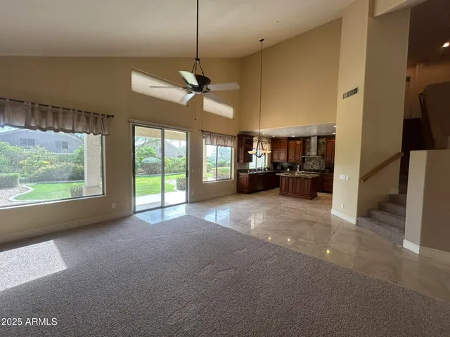 a view of a livingroom with furniture and a garage