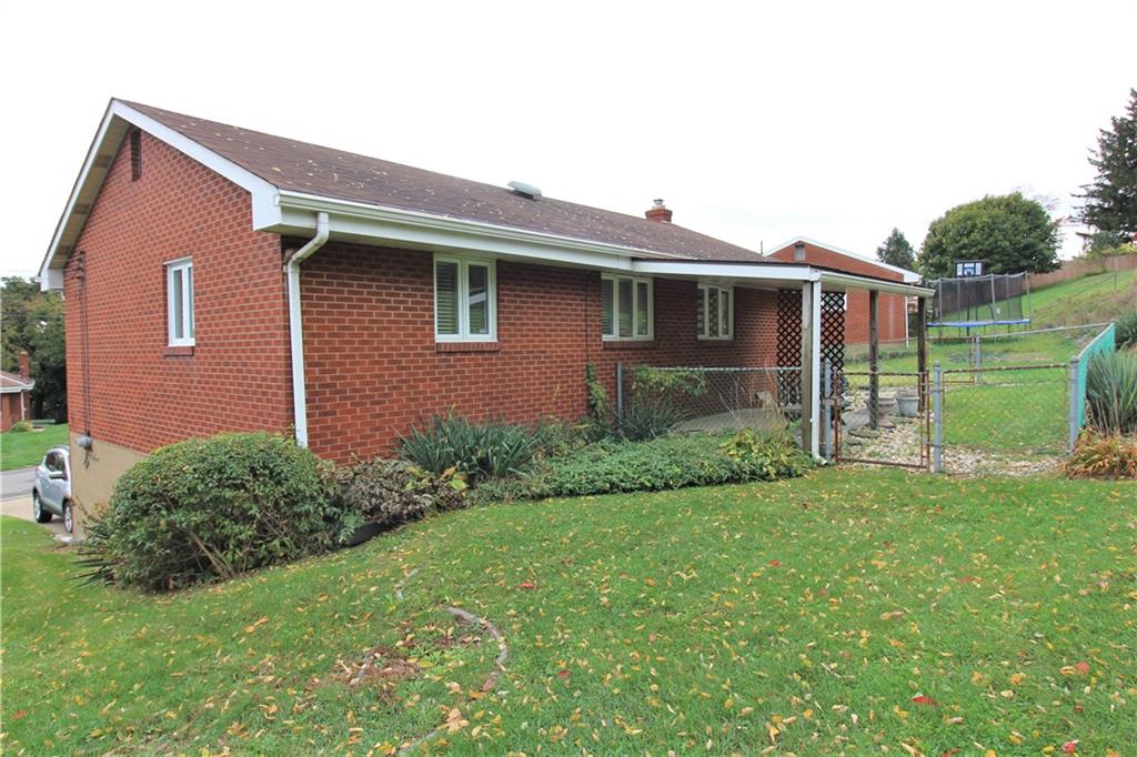 106 Flicker Drive McKees Rocks, PA 15136 - Photo 3 of 17 Rear yard with small fenced in area for your small pets or garden !