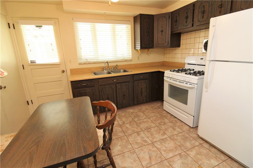 106 Flicker Drive McKees Rocks, PA 15136 - Photo 7 of 17 Kitchen with built in seating and access to side yard