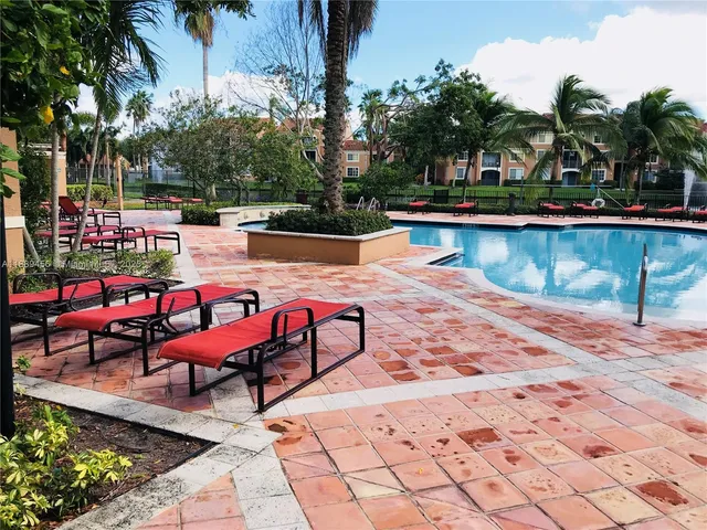 a view of swimming pool with outdoor seating