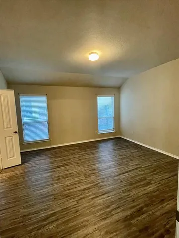 a kitchen with stainless steel appliances granite countertop a refrigerator a sink and a stove