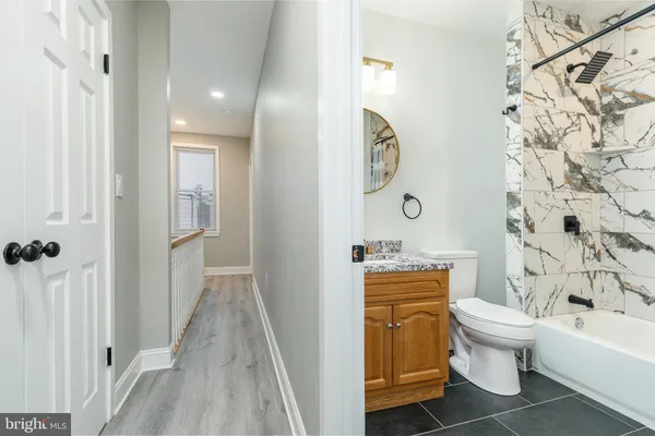 a bathroom with a toilet a sink and a bathtub
