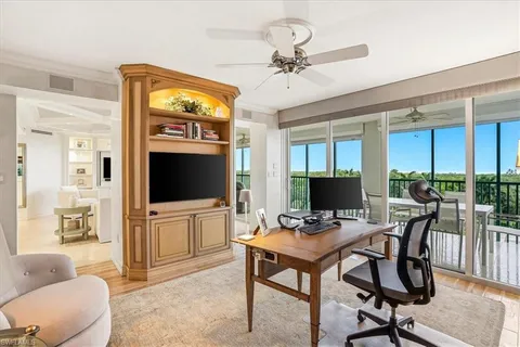 a view of a livingroom with furniture and a flat screen tv