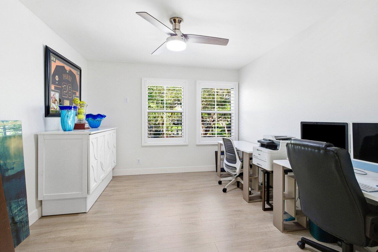 5696 Northwest 39th Avenue Boca Raton, FL 33496 - Photo 12 of 24 a view of a workspace with furniture and a window