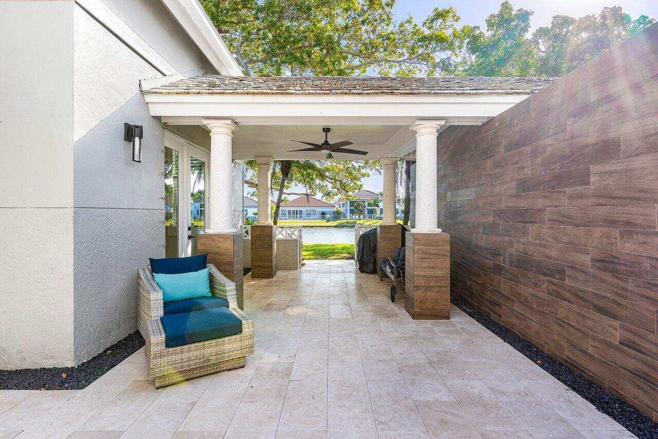 5696 Northwest 39th Avenue Boca Raton, FL 33496 - Photo 19 of 24 a view of two chairs in the patio