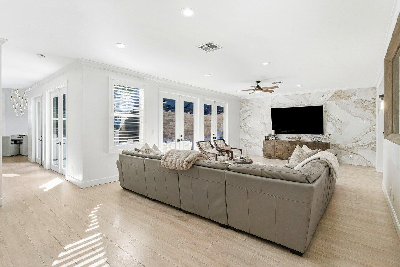 5696 Northwest 39th Avenue Boca Raton, FL 33496 - Photo 4 of 24 a living room with furniture and a flat screen tv