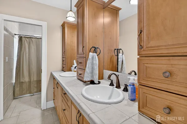 a bathroom with a sink and a mirror