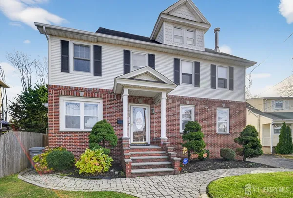 front view of a house with a garden