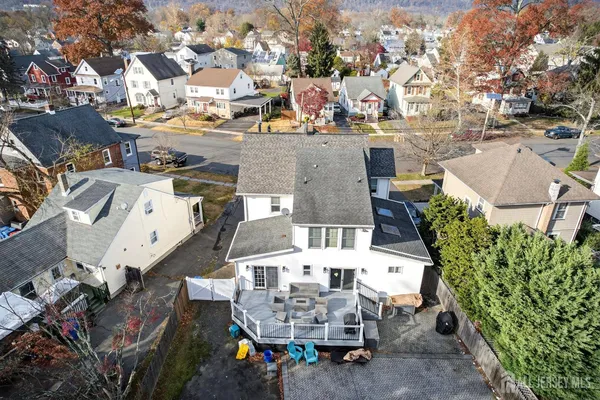 an aerial view of multiple houses with outdoor space
