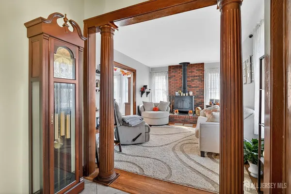 a living room with furniture and a mirror