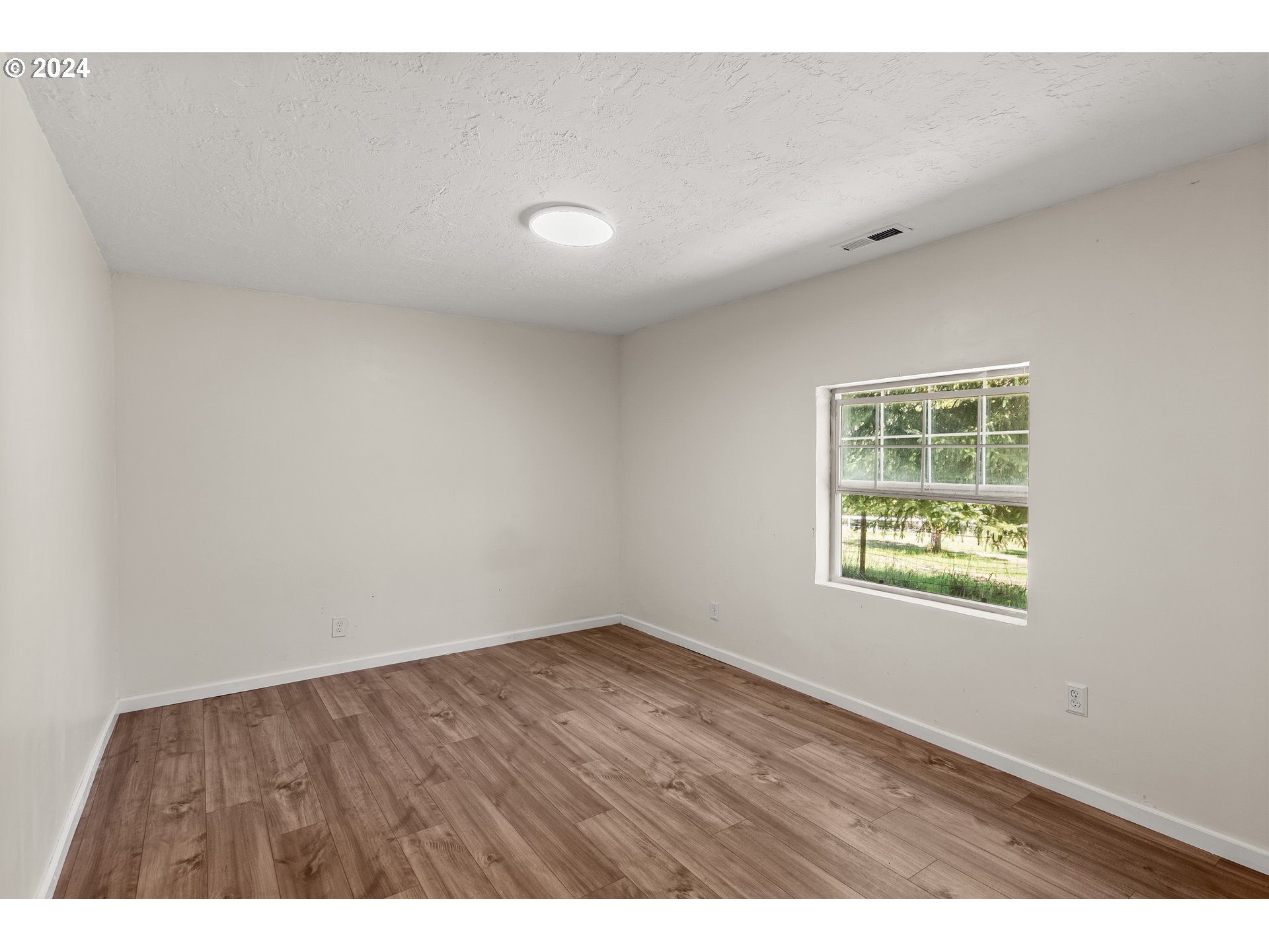 72523 Apiary Road Rainier, OR 97048 - Photo 16 of 23 a view of an empty room with a window
