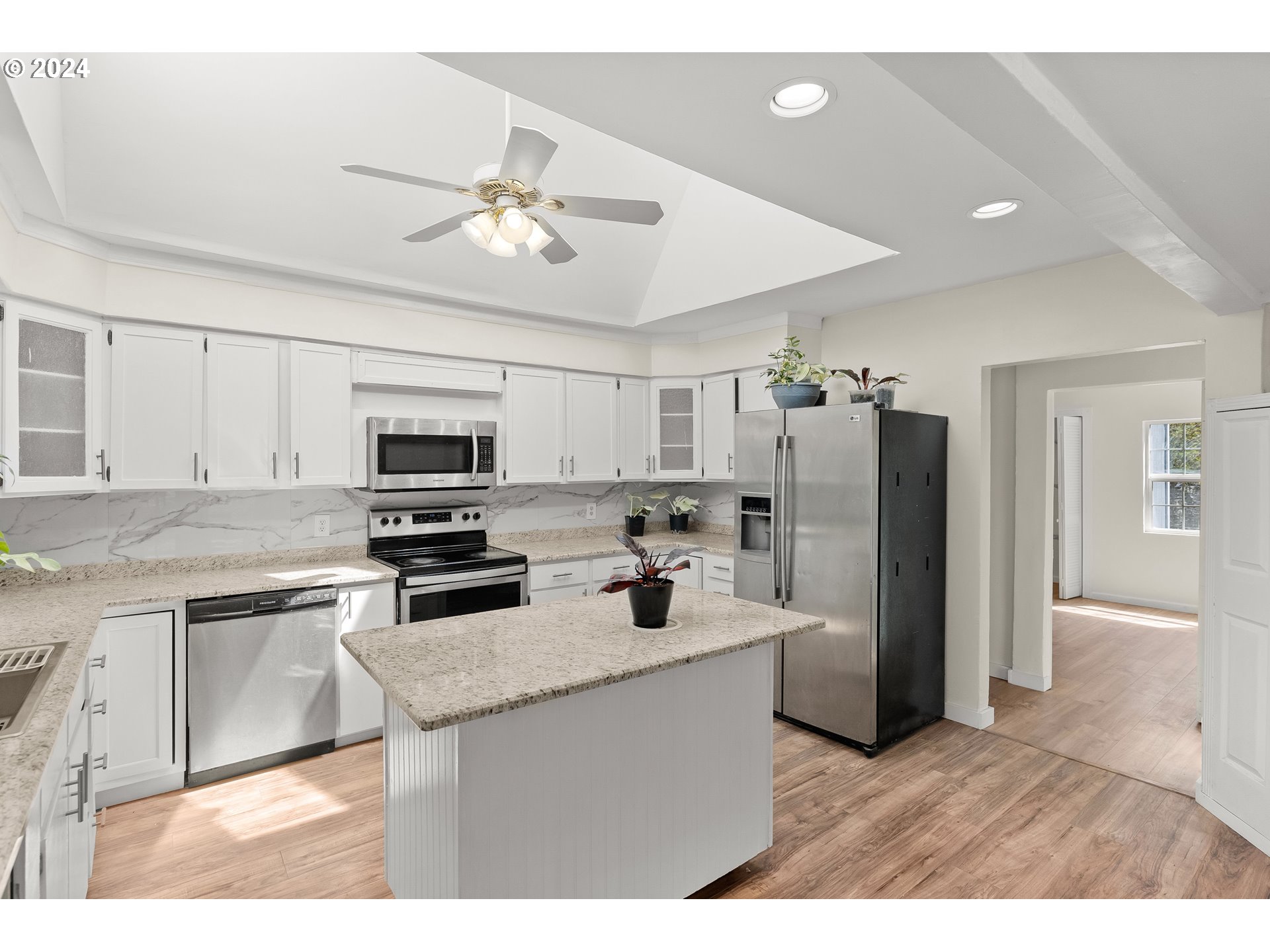 72523 Apiary Road Rainier, OR 97048 - Photo 6 of 23 a kitchen with stainless steel appliances a sink stove refrigerator and cabinets