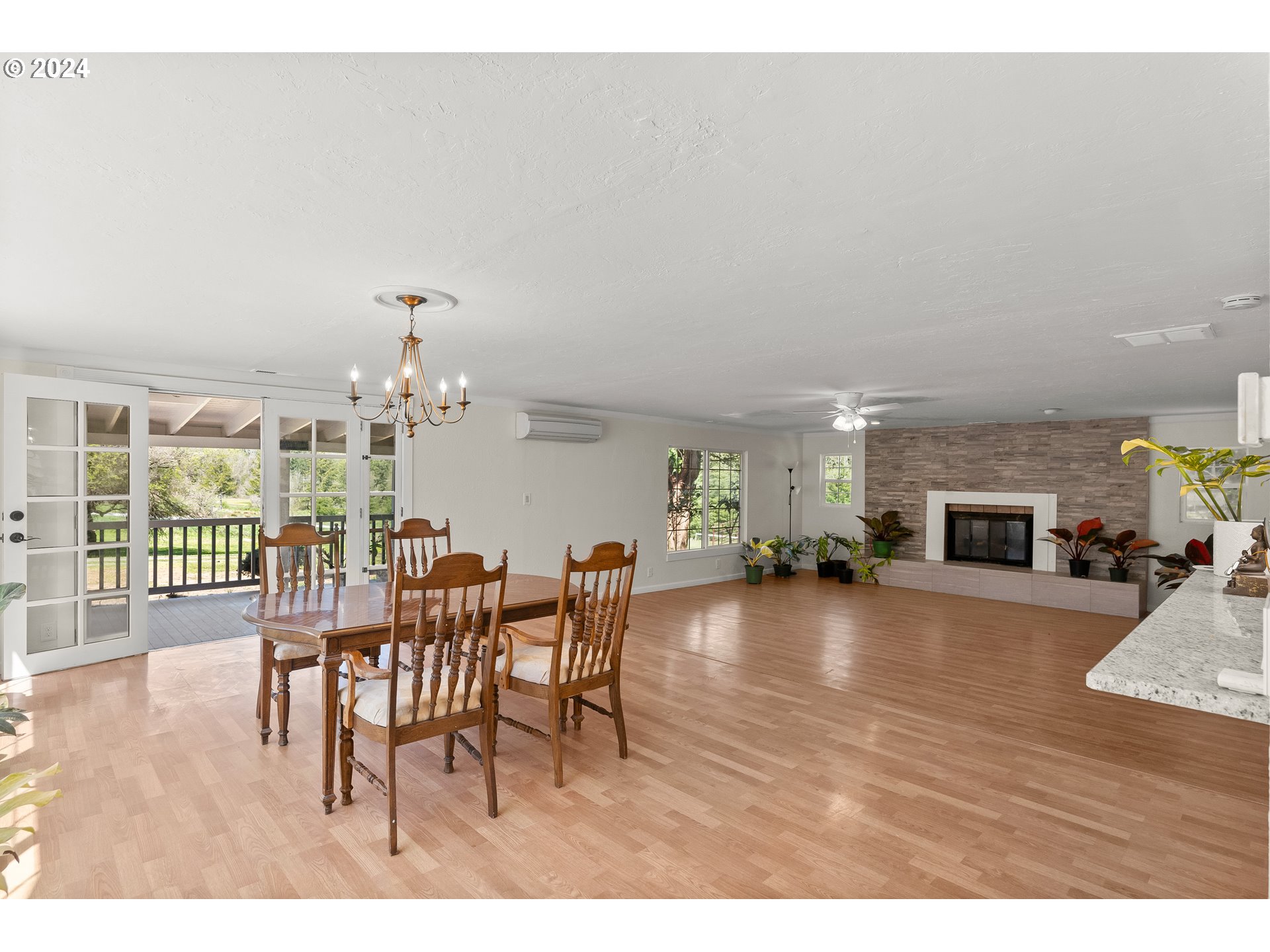 72523 Apiary Road Rainier, OR 97048 - Photo 8 of 23 a view of a dining room with furniture window and wooden floor
