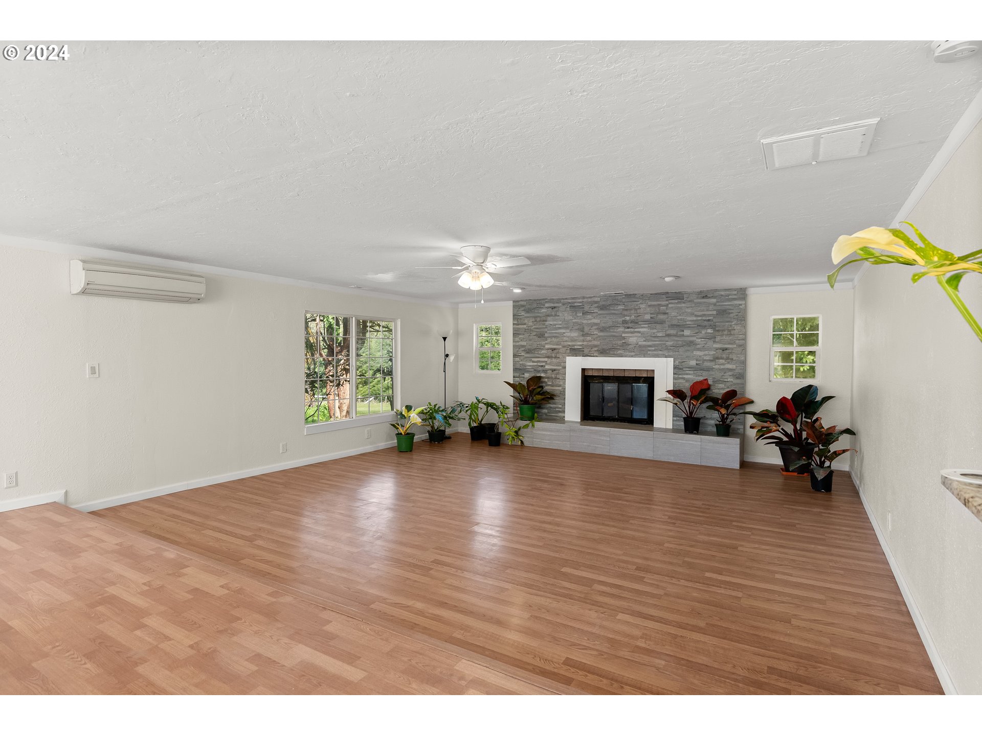 72523 Apiary Road Rainier, OR 97048 - Photo 9 of 23 a view of empty room with fireplace and wooden floor