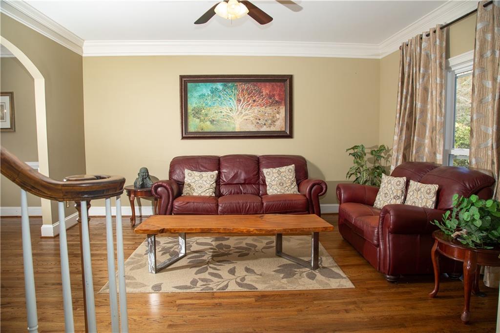 5735 Sunset Maple Drive Alpharetta, GA 30005 - Photo 13 of 39 a living room with furniture and a large window